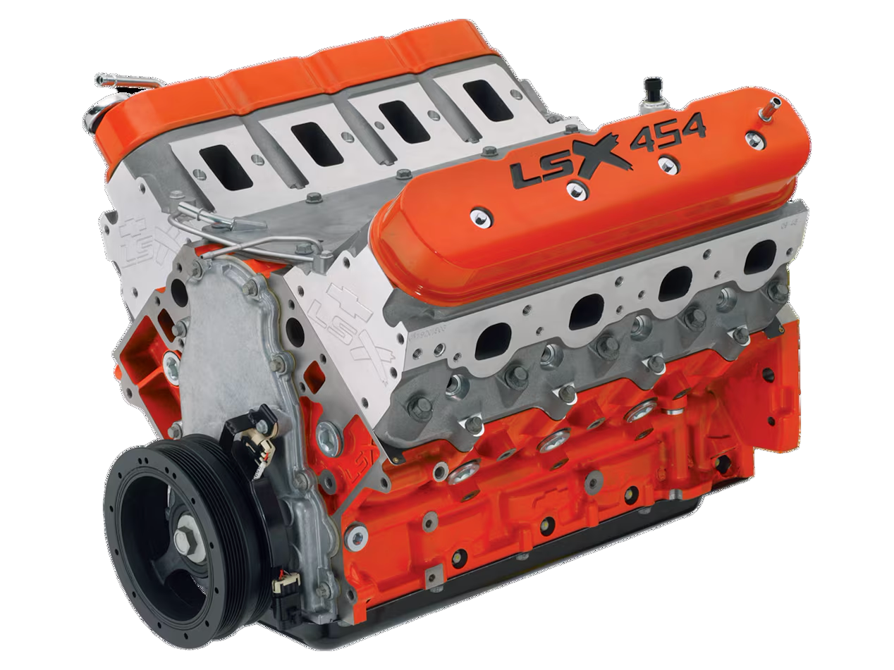 A close up of a lsx 454 engine on a white background