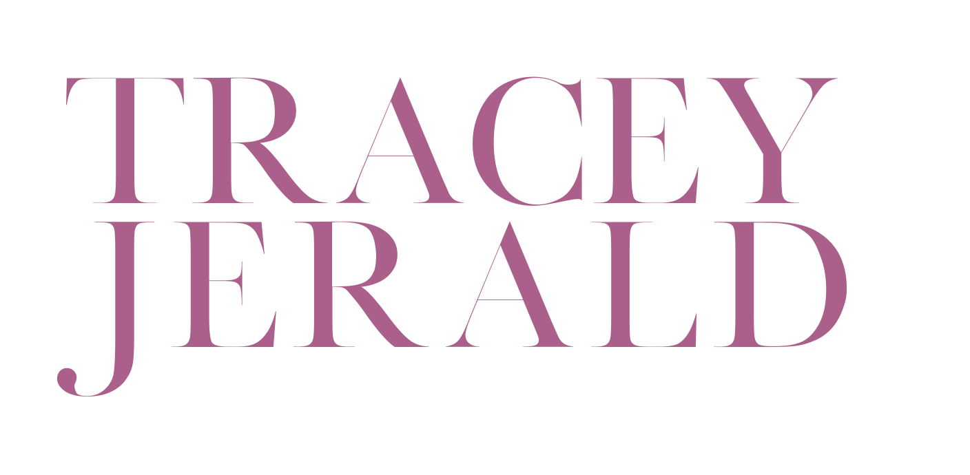 The logo for tracey jerald is purple and white on a white background.