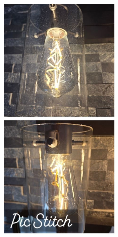 Two lit glass bottles on a dark tiled counter, glowing with warm yellow light