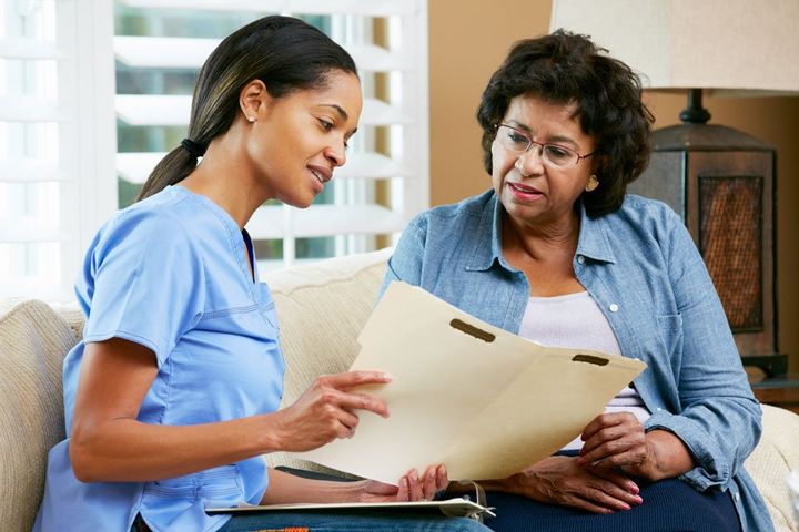 An elderly woman being examined
