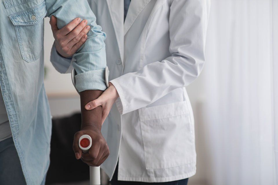 A person getting help with physical therapy