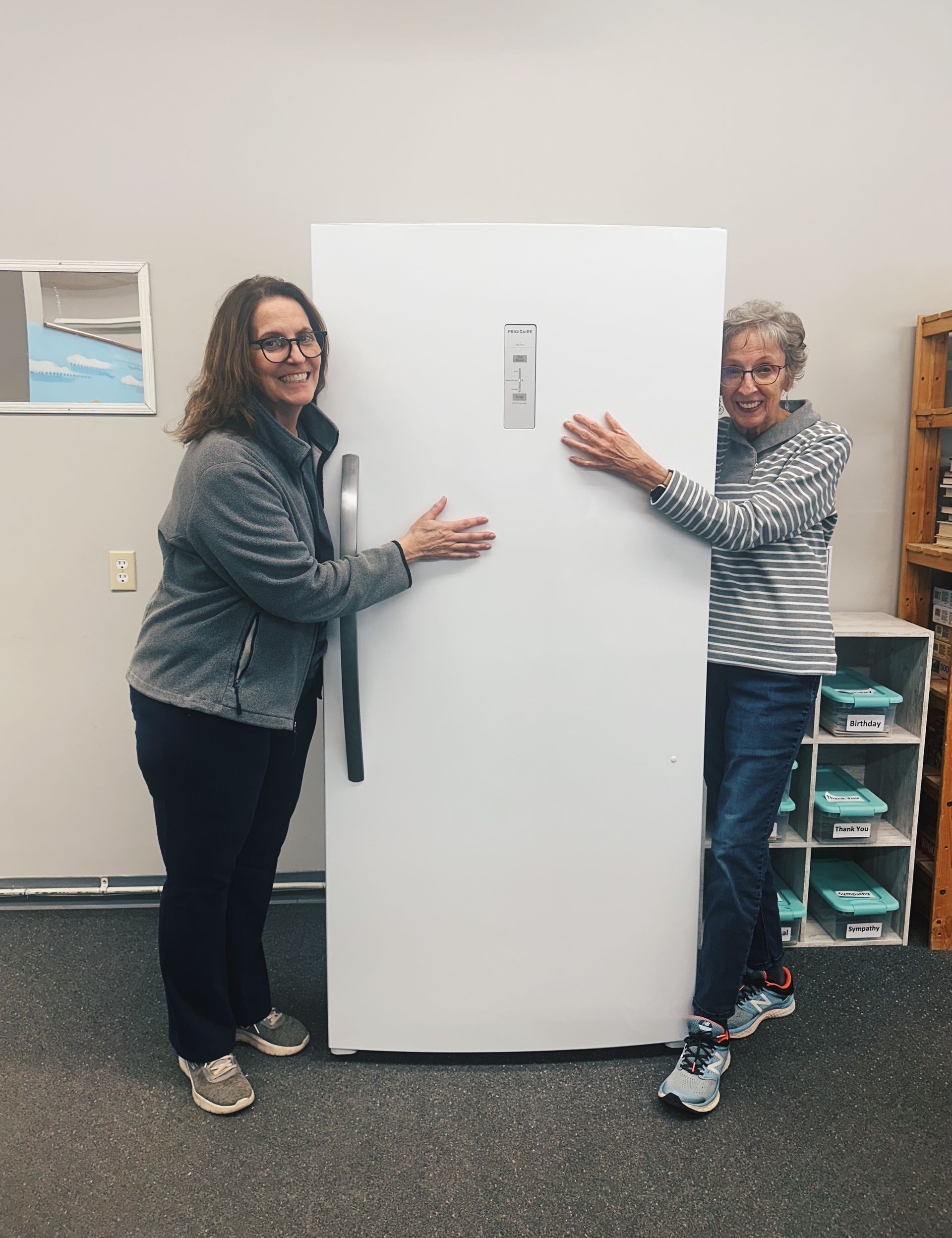 Hot Springs Food Pantry Volunteers Pose with Their New Refrigerator | Roux LLC Franklin, TN
