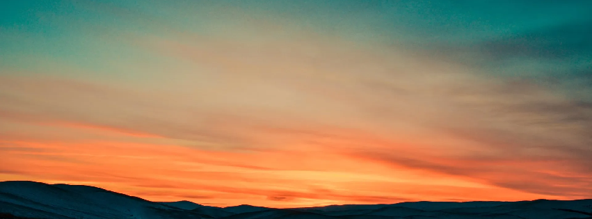 A sunset over a mountain range. Spiritual