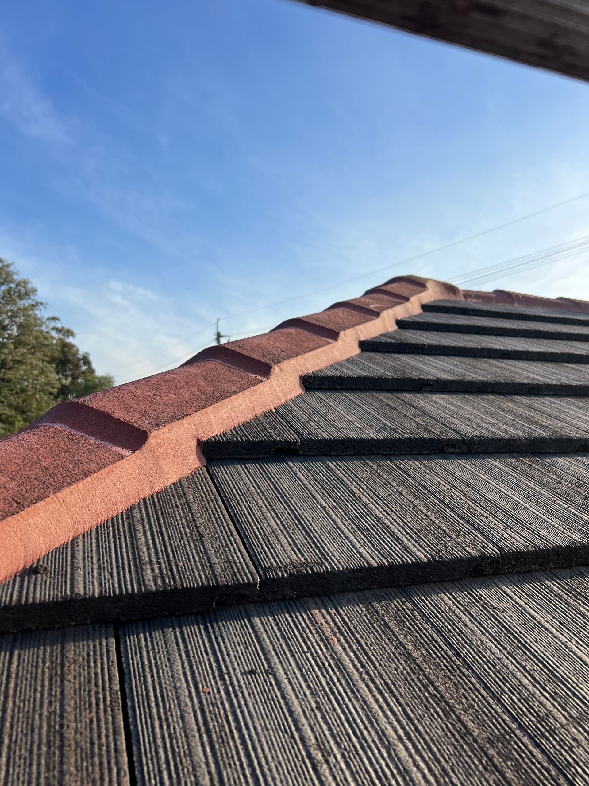 A Close Up Of A Roof With Tiles — The Gutter Guy NSW in Wollongong, NSW