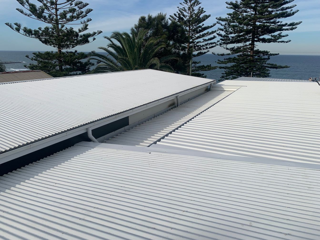 White Roof With Ocean In the Background — The Gutter Guy NSW in Corrimal, NSW