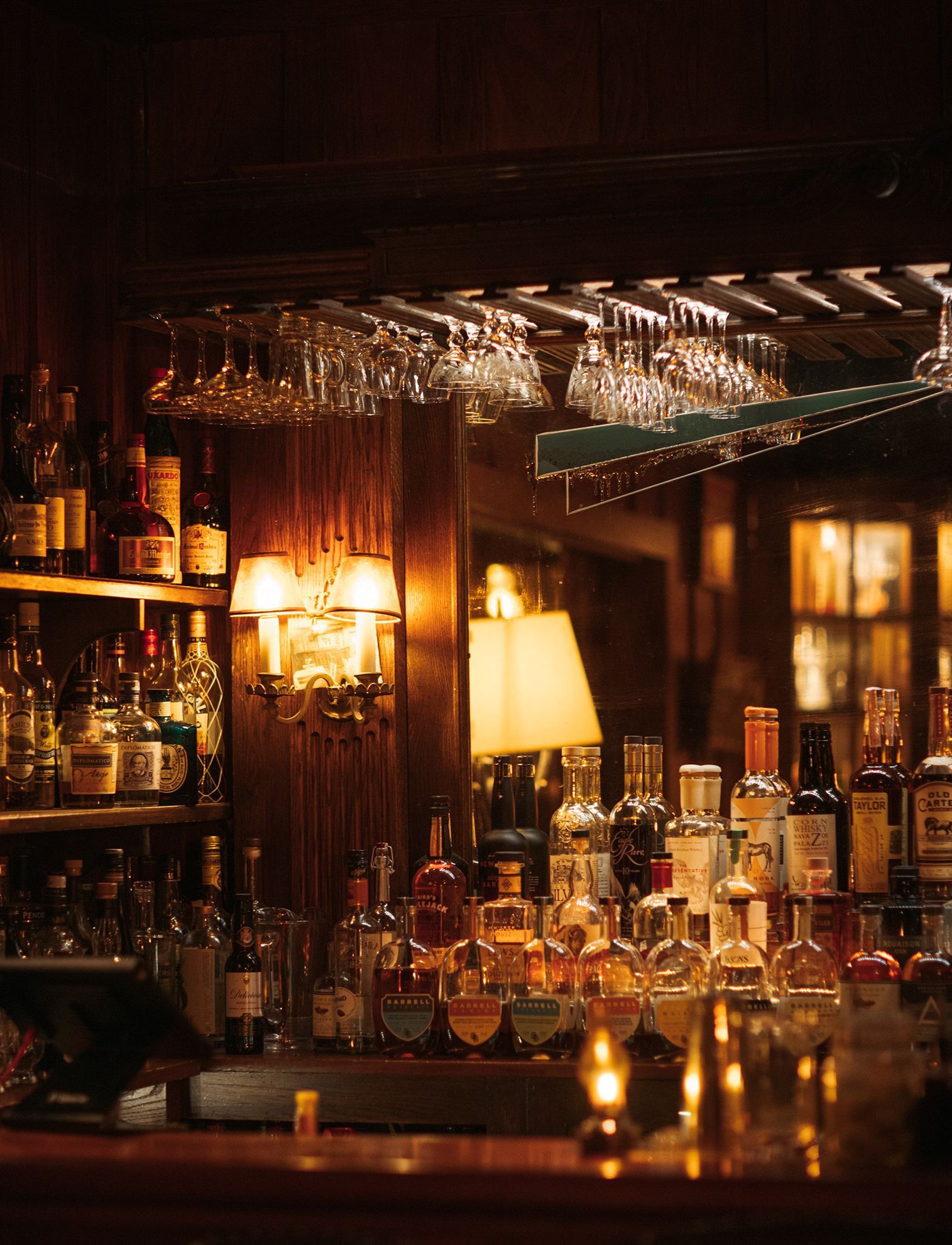 A bar filled with lots of bottles and glasses