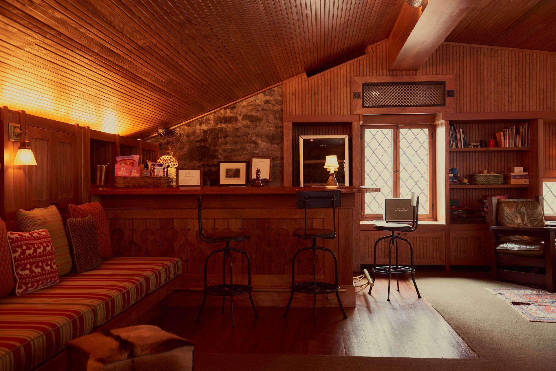 A living room with a bar and a couch