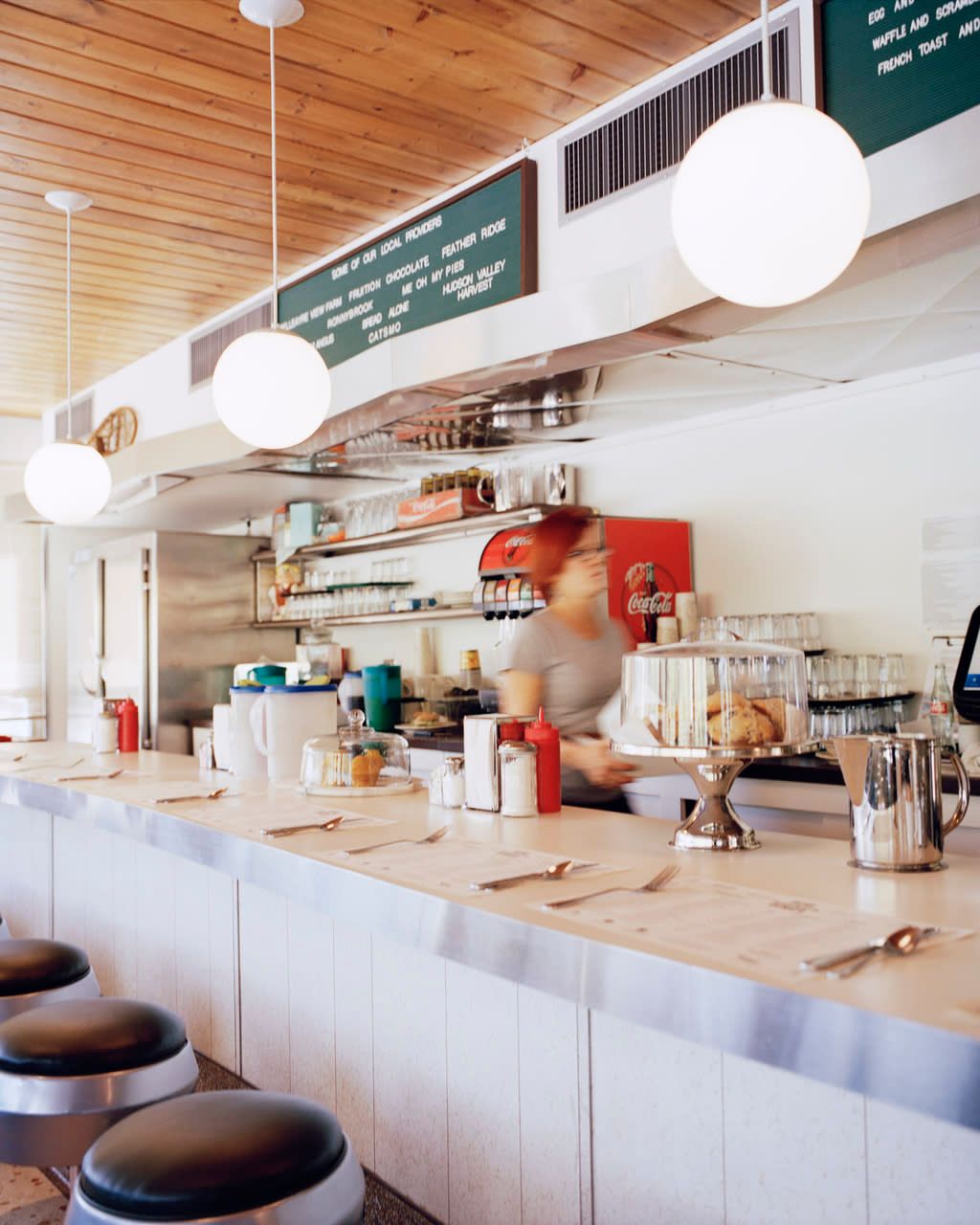 A diner with a sign that says ' coca cola ' on it