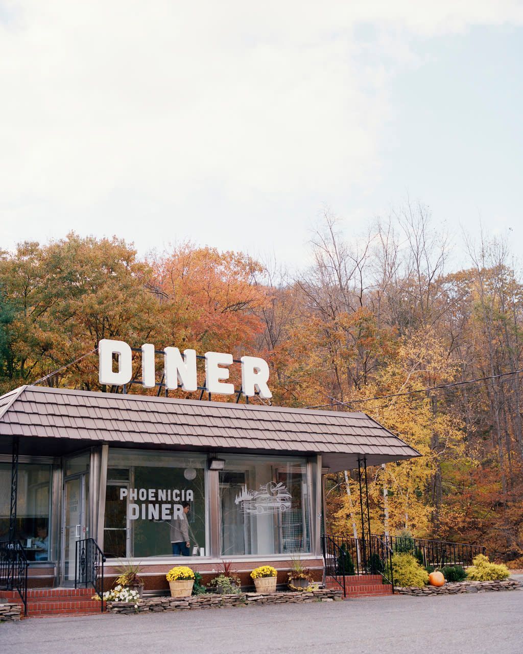 A diner with a sign that says diner on it