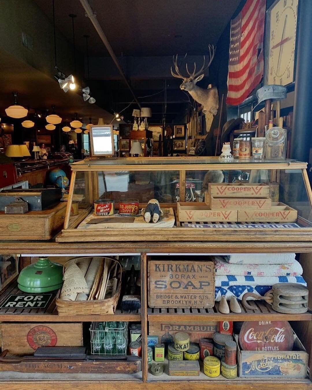 A store filled with lots of items including a coca cola box