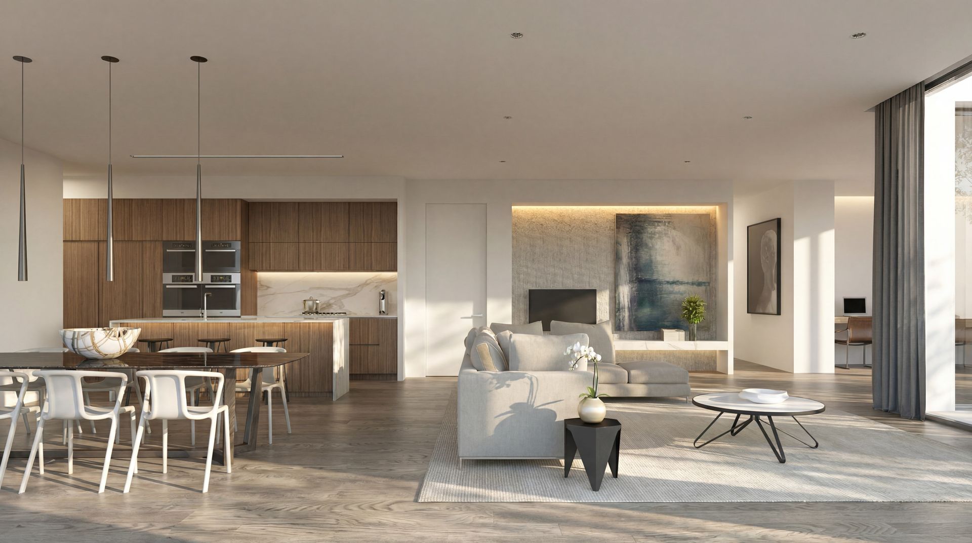 Modern open-plan living room and kitchen with neutral furniture, wood accents, and large windows overlooking a balcony