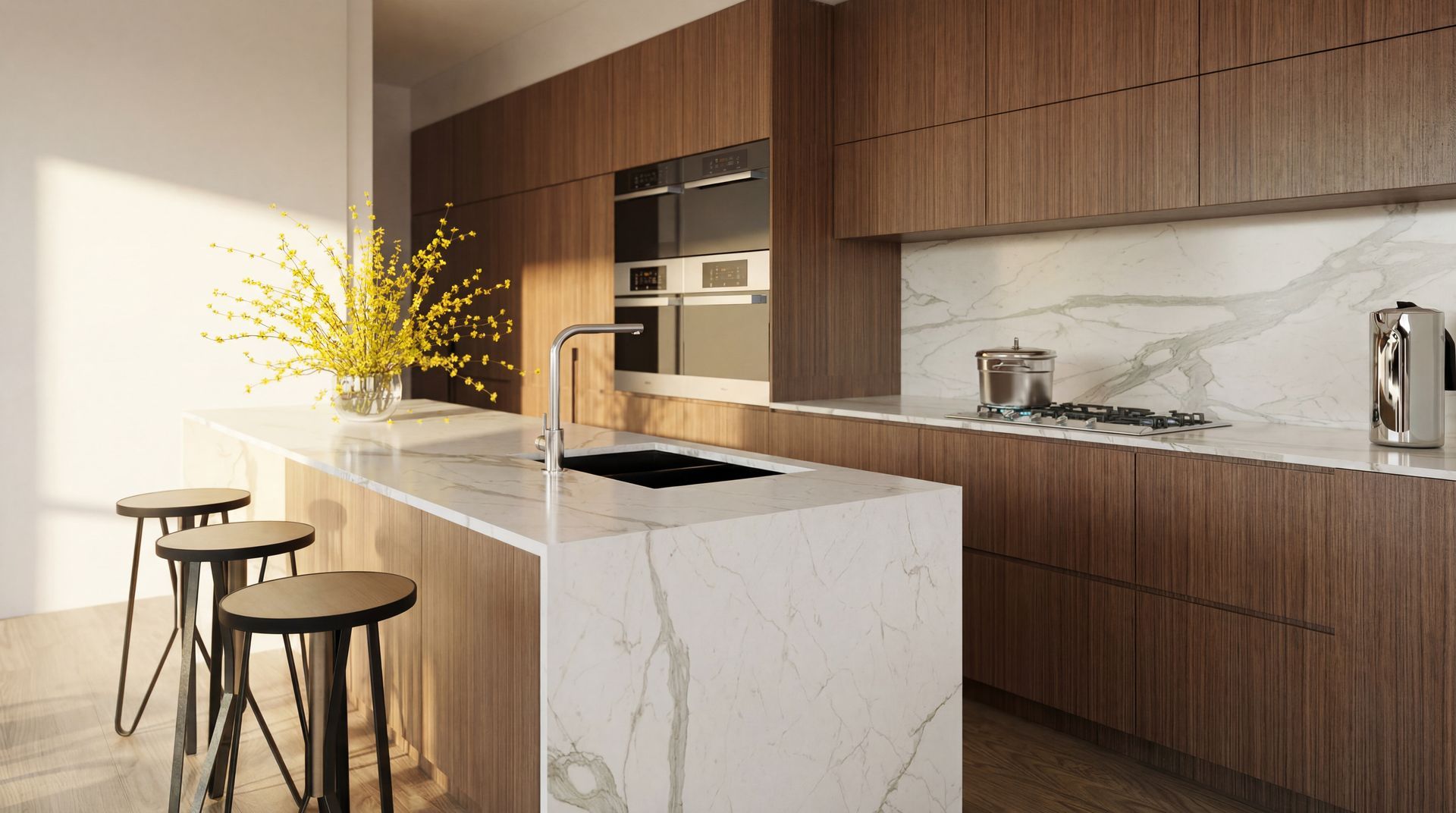 Modern kitchen with wood cabinets, marble island, stools, and sunlight streaming in from the left