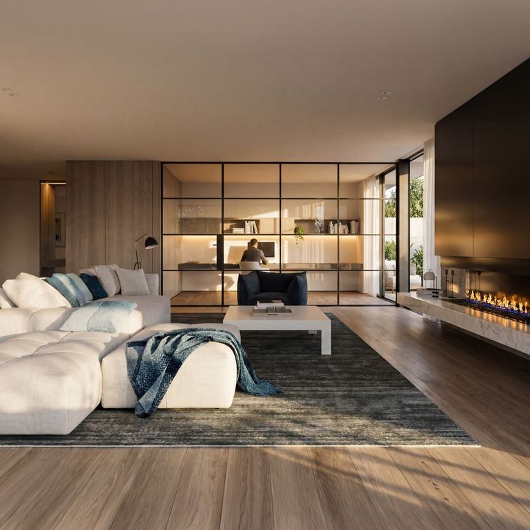 Modern minimalist living room with white sectional sofa, built-in fireplace, and glass shelving divider