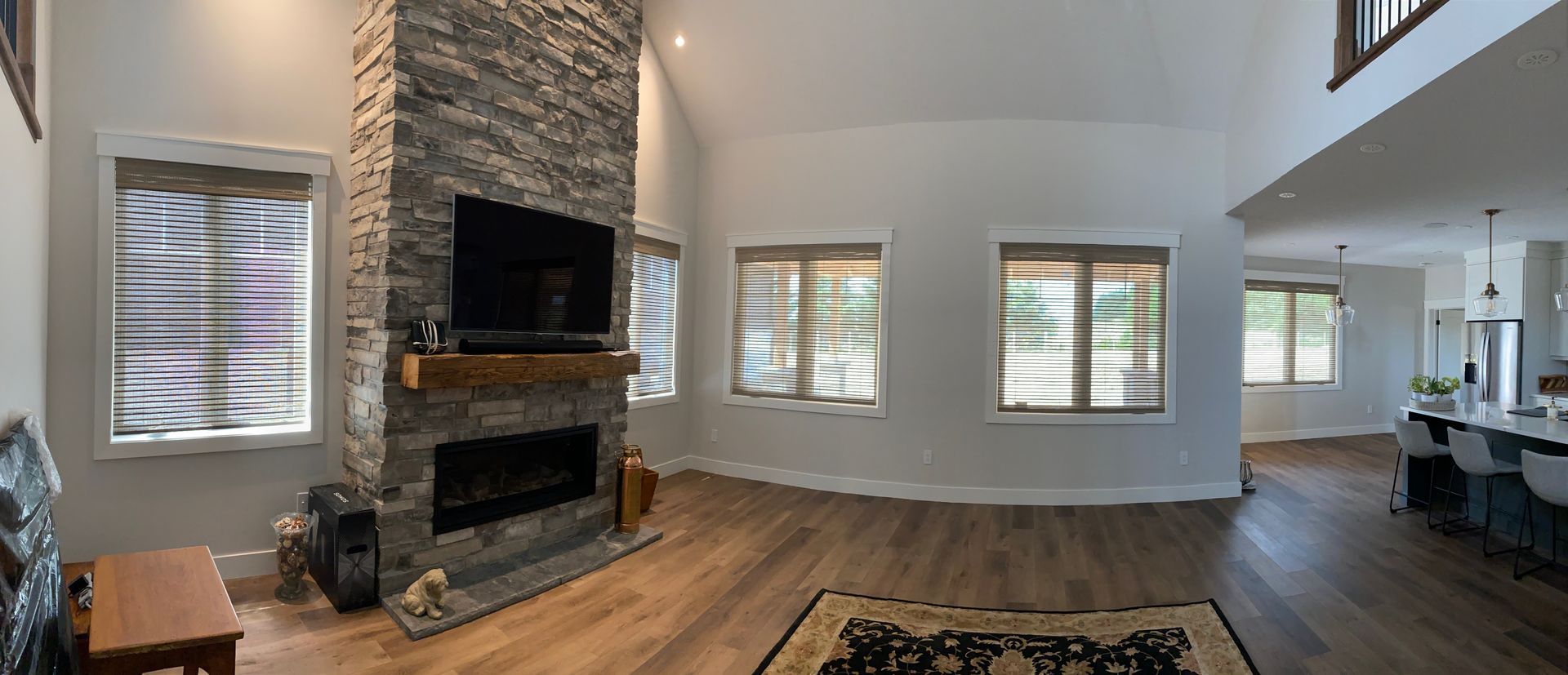 A living room with a fireplace and a flat screen tv.
