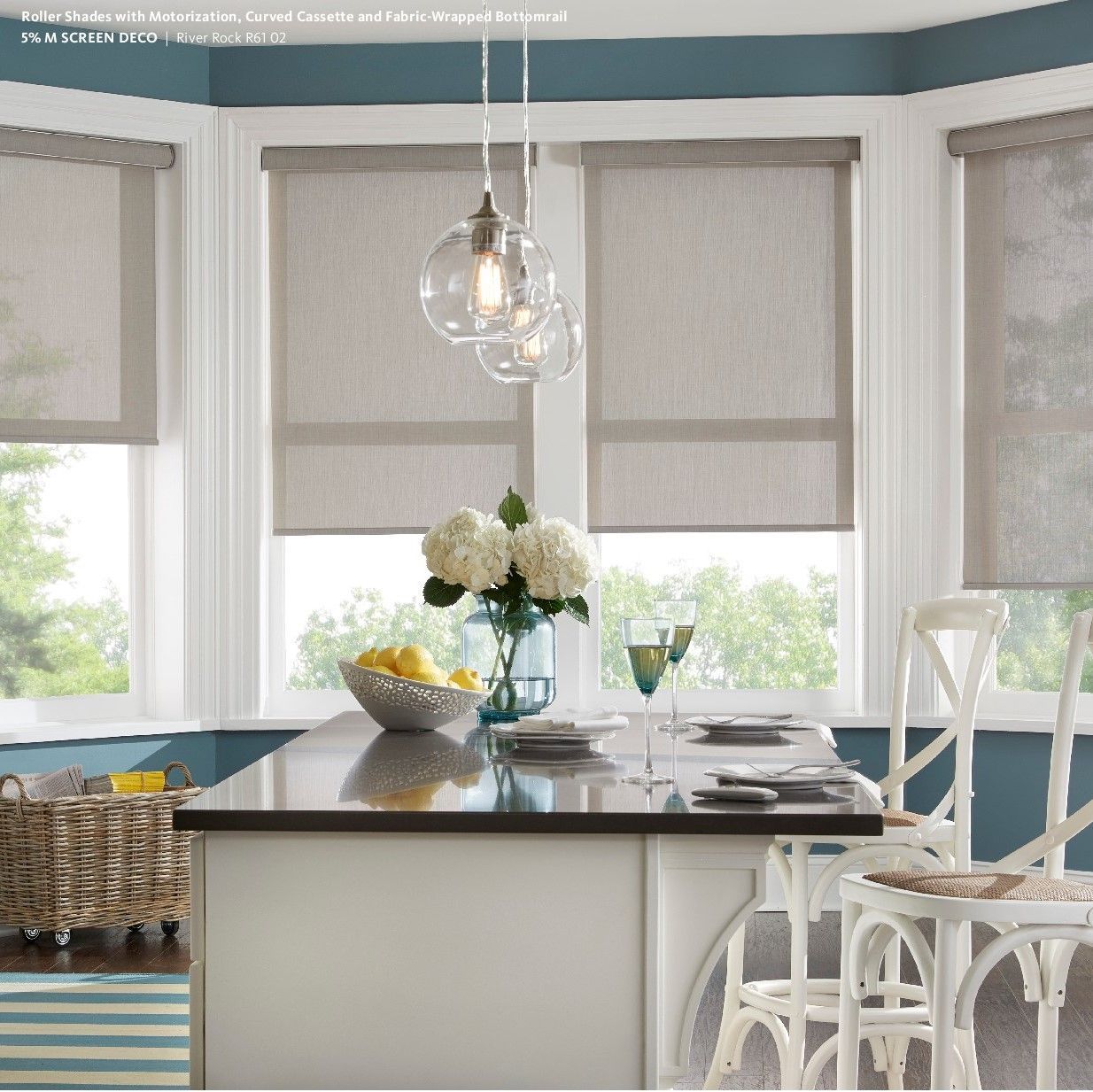 A kitchen with a table and chairs and a vase of flowers on it
