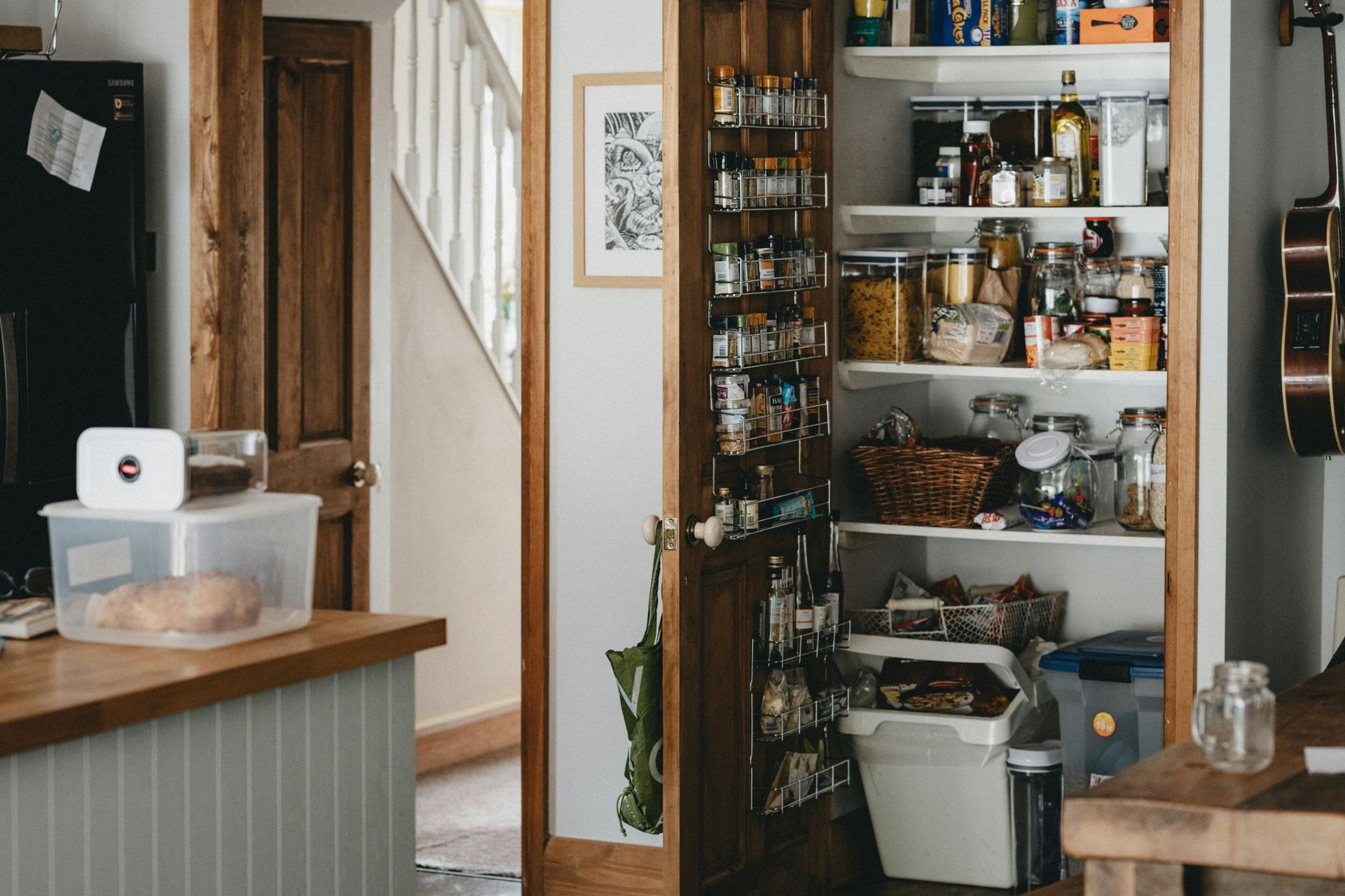 Spacious garage with red cabinets and drawers, gray floor, and overhead lighting.