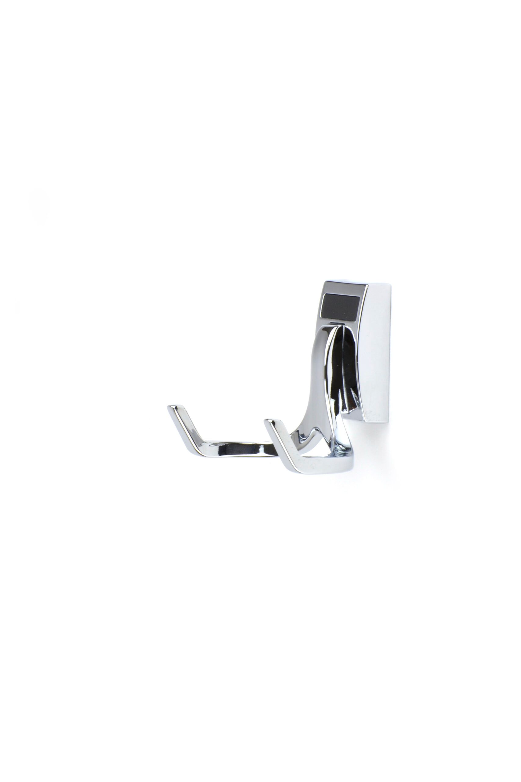 A close up of a hook on a wall on a white background.