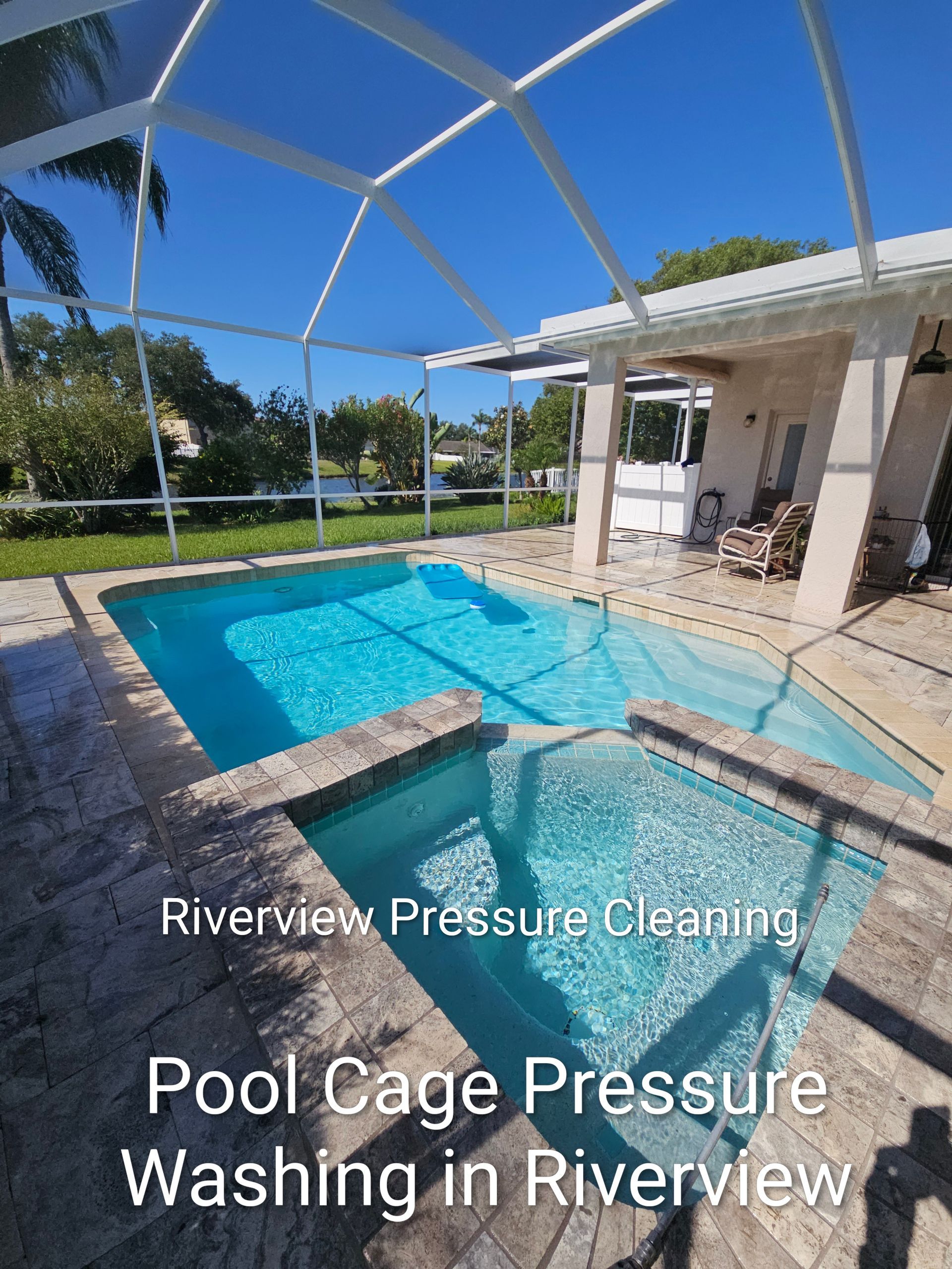 Blue backyard pool under white screen enclosure beside a patio, sunny day in Riverview.
