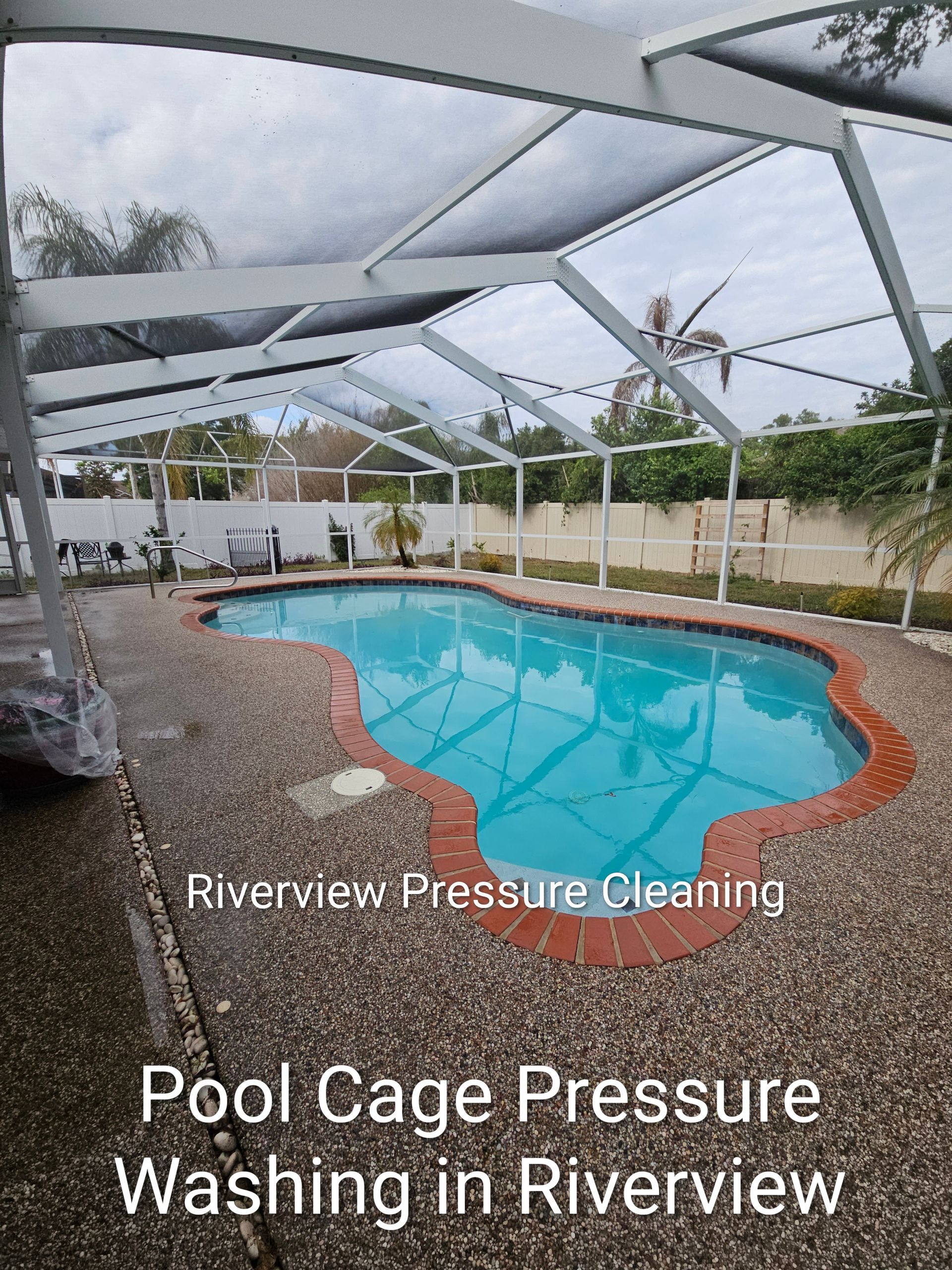 Outdoor covered pool with blue water and patio, labeled “Pool Cage Pressure Washing in Riverview”