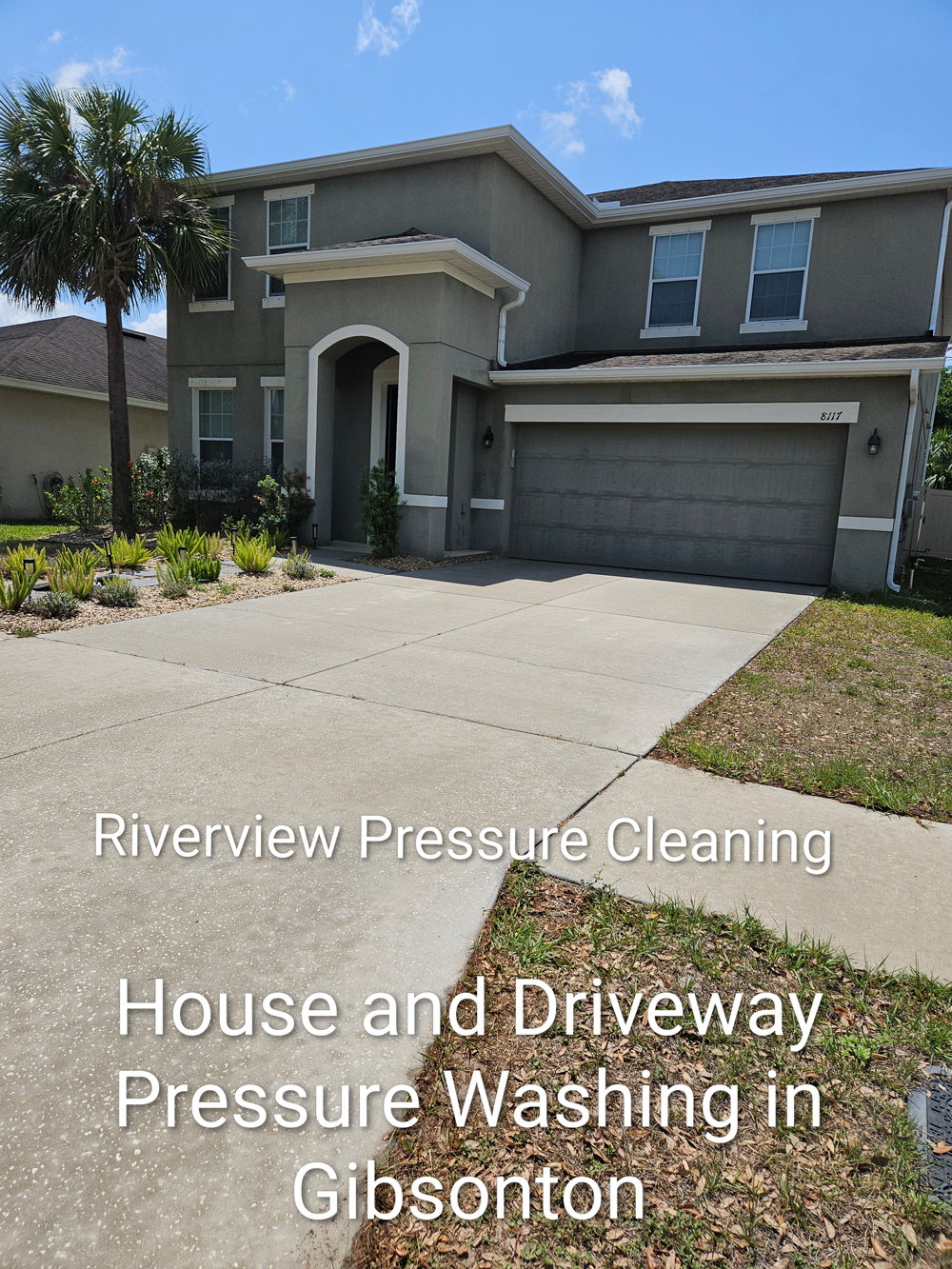 Two-story gray house with driveway, text advertising Riverview Pressure Cleaning house and driveway washing in Gibsonton