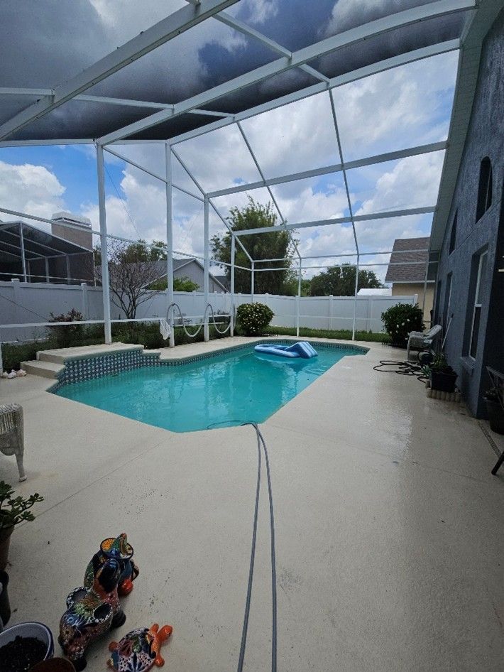 Clean pool cage screens and deck after pressure washing in Riverview