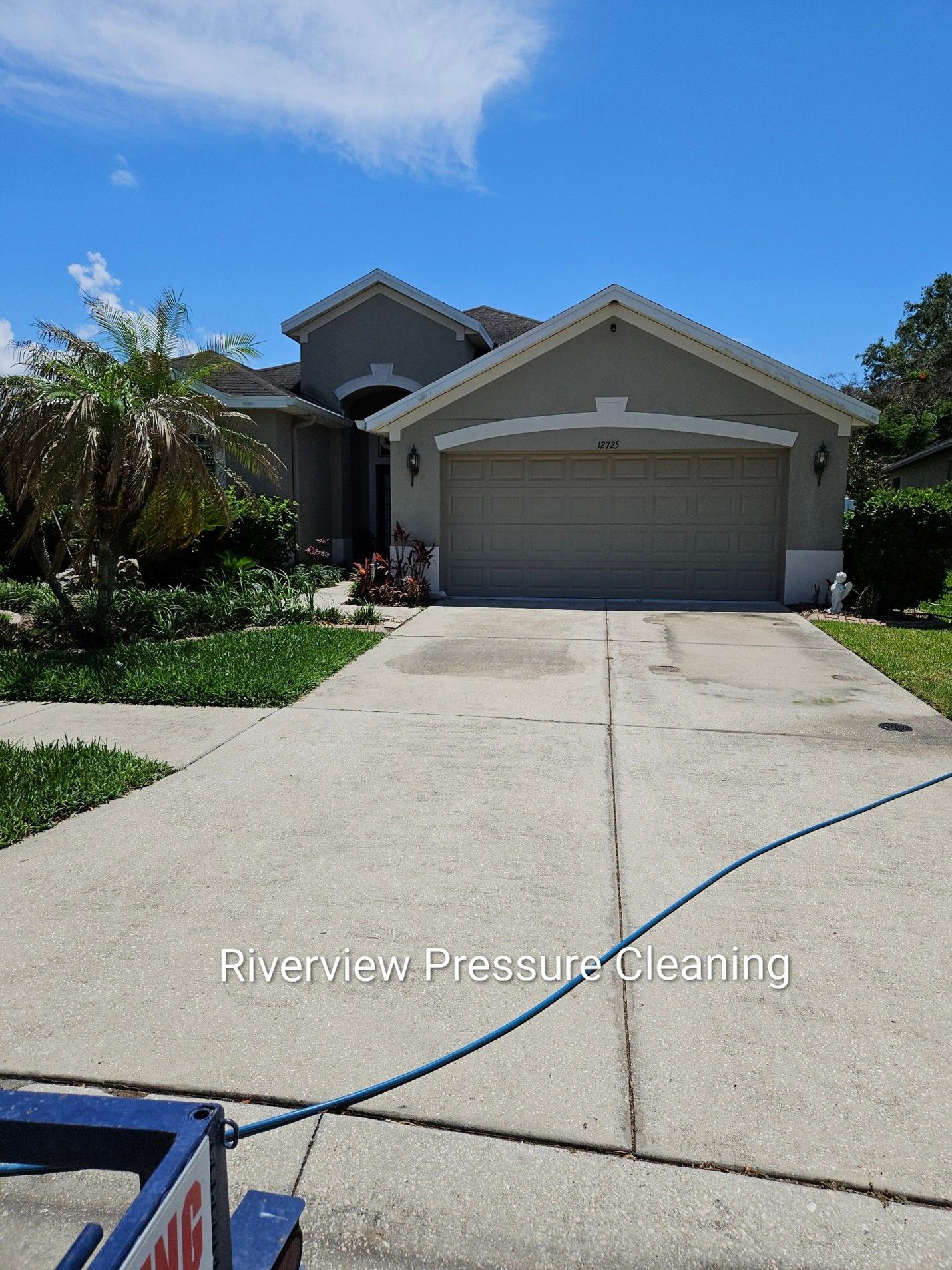 Clean driveway and freshly washed house exterior after pressure washing in Riverview Florida