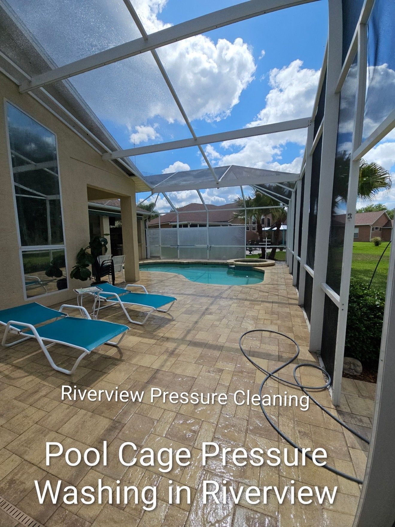 Pool cage pressure washing with turquoise chairs by a screened backyard pool under a blue sky