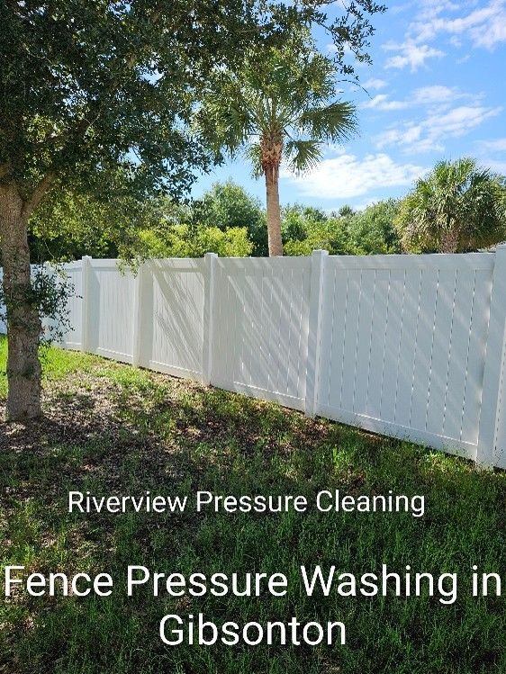 Clean paver patio and vinyl fence after pressure washing service in Gibsonton