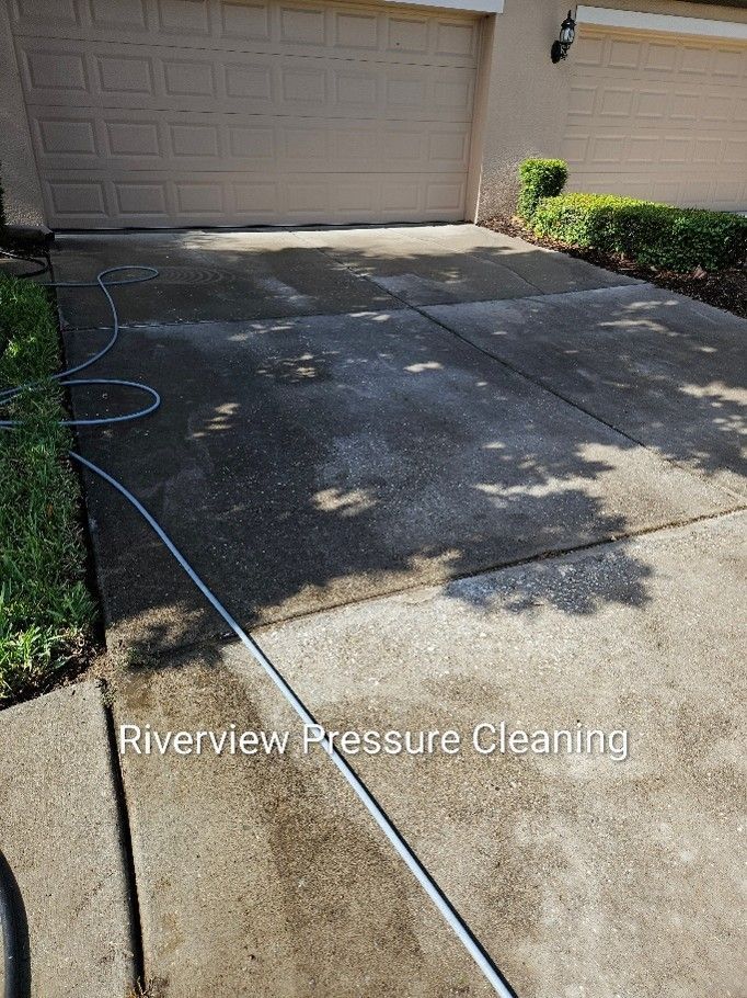 Driveway with algae, mold, and dirt before pressure washing in Apollo Beach FL