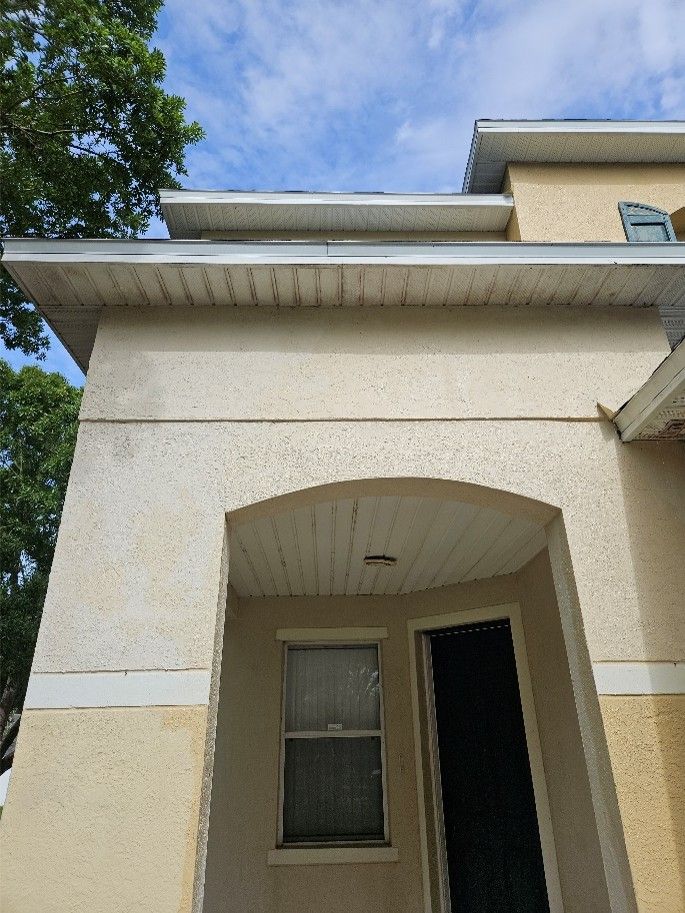 Clean white soffits after professional house pressure washing in Riverview FL