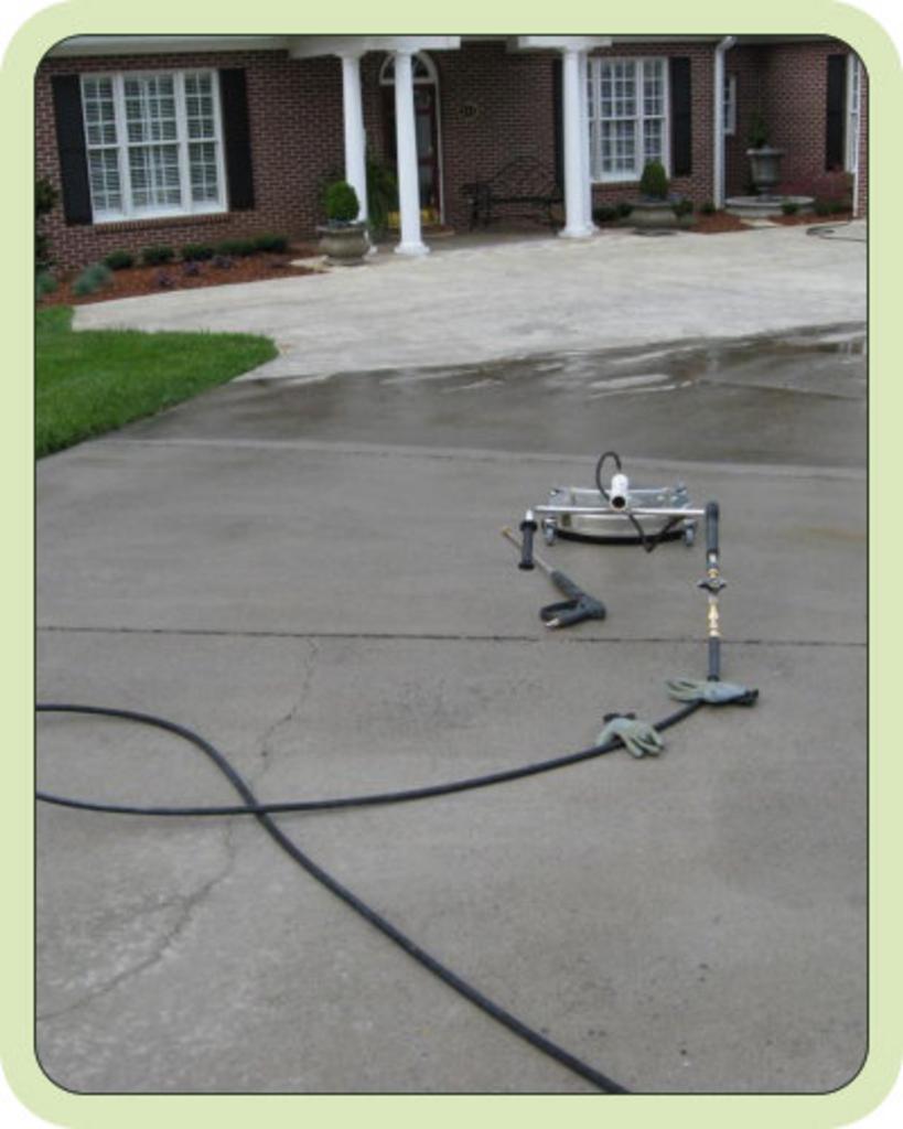 pressure washing equipment in the driveway