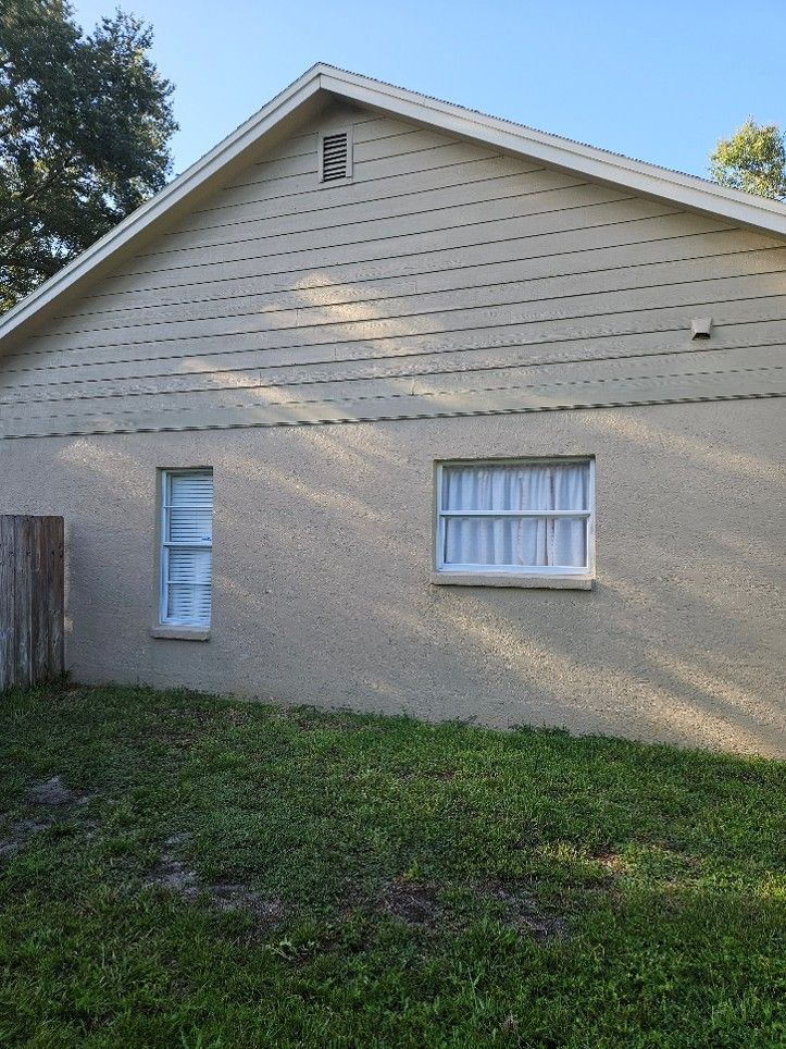 House exterior before and after cleaning showing algae removal