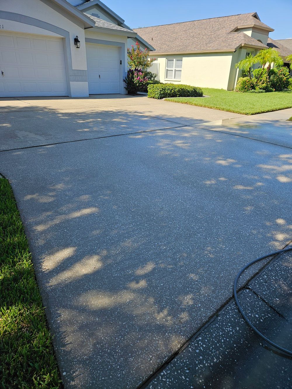 Clean residential driveway after pressure washing in Valrico, FL