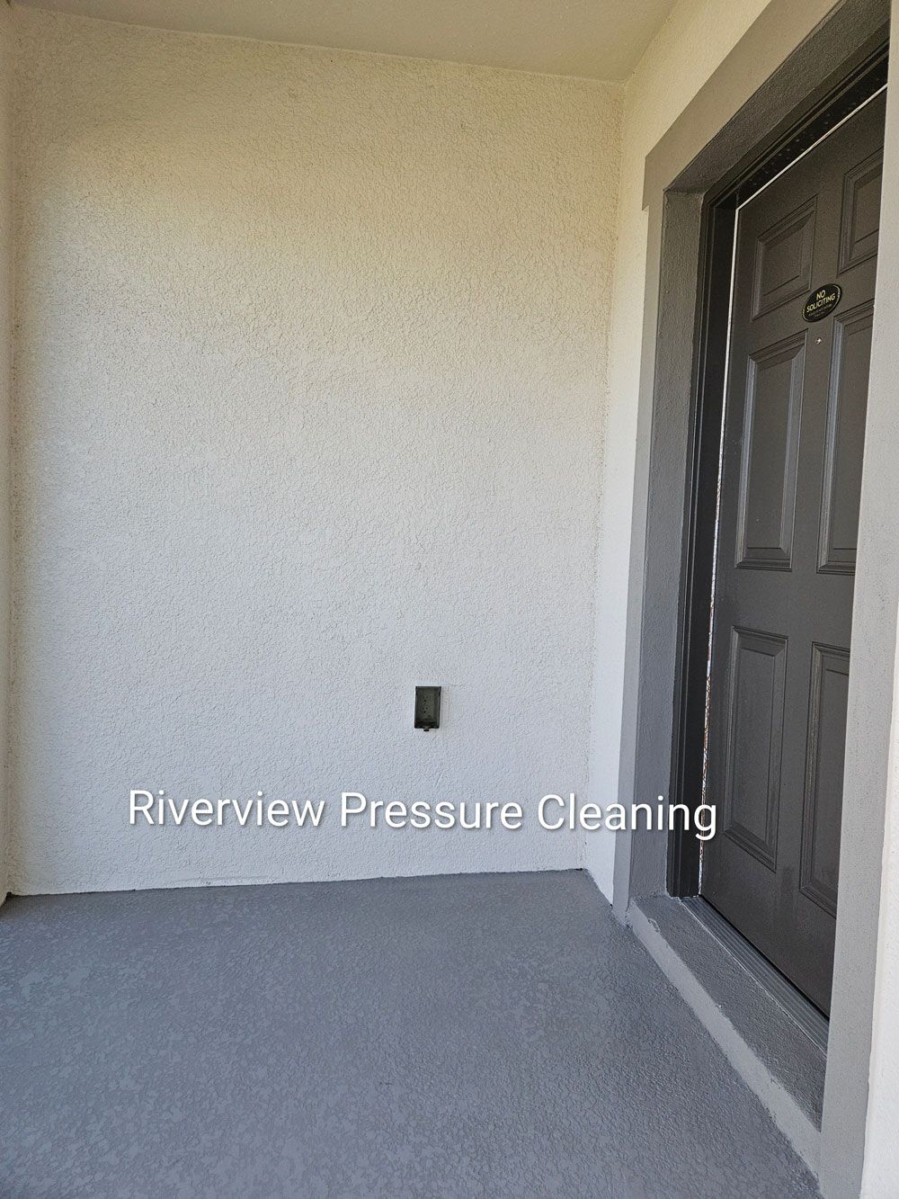 Clean front porch and soffits after house pressure washing in Riverview