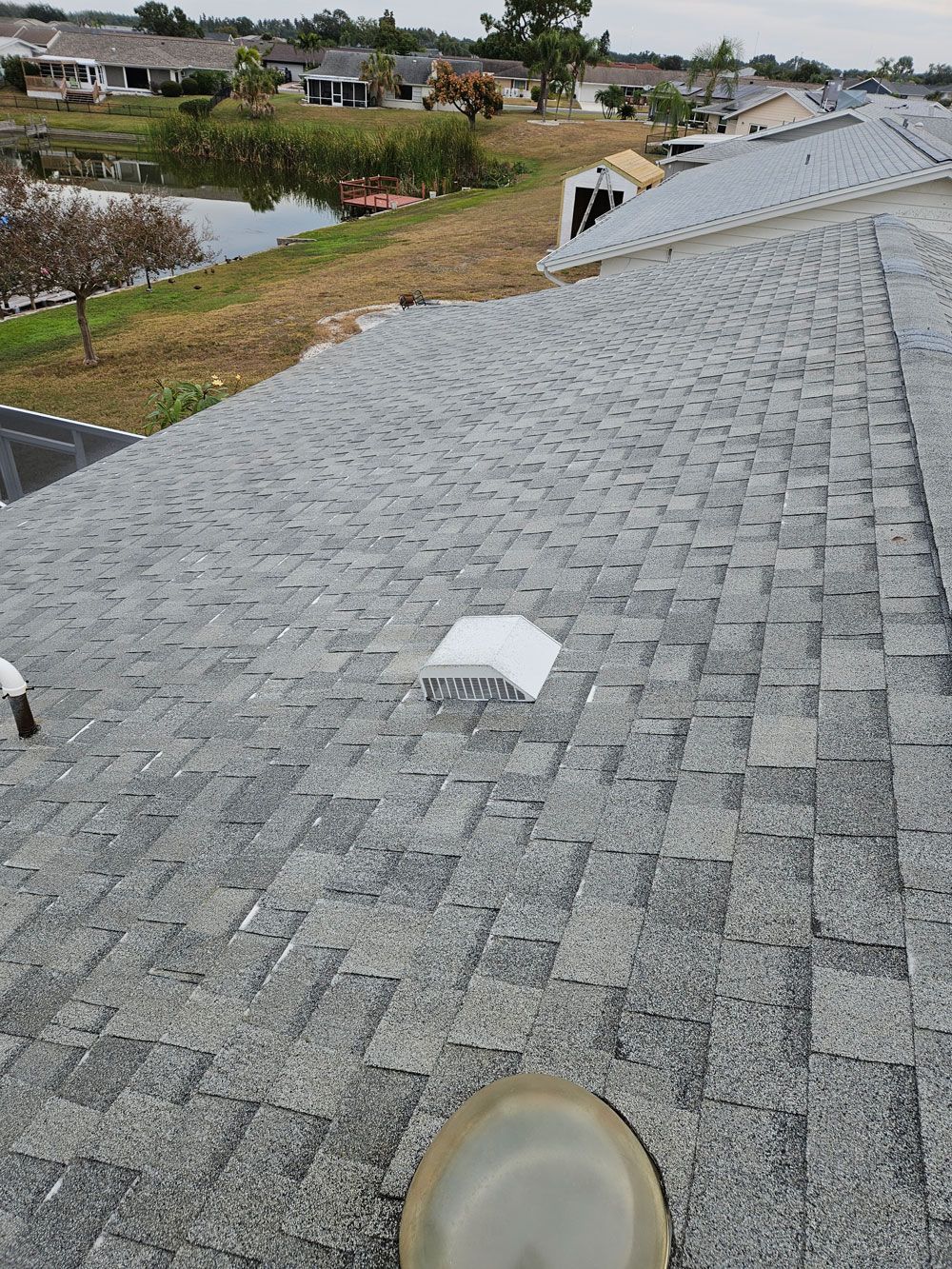 Photo of a clean asphalt shingle roof in Valrico, FL