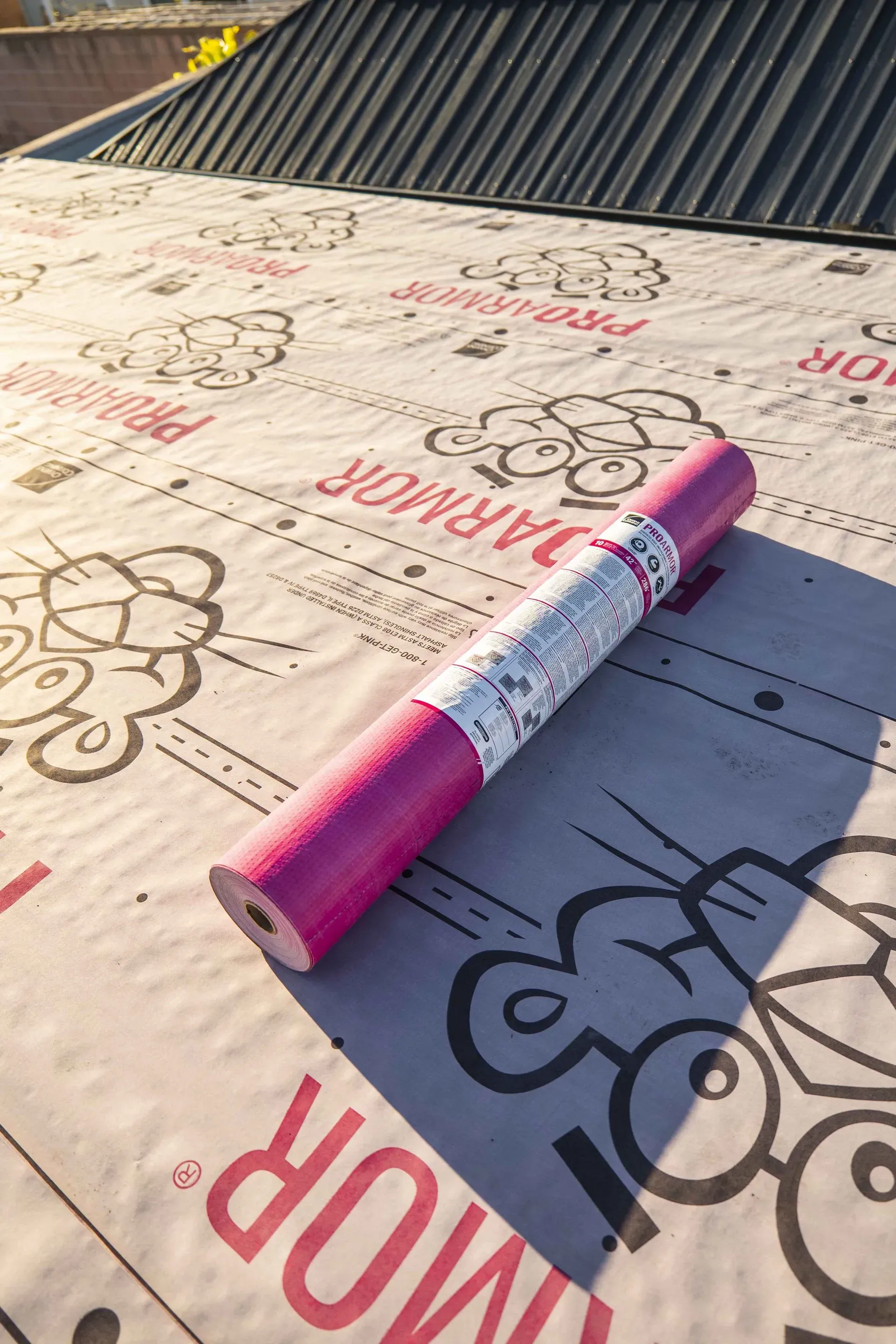 A man is installing a solar panel on a roof