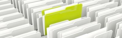 Rows of white file folders with one bright lime-green folder standing out in front