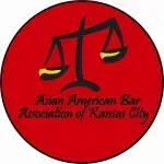 The asian american bar association of kansas city logo is a red circle with a scale of justice on it.