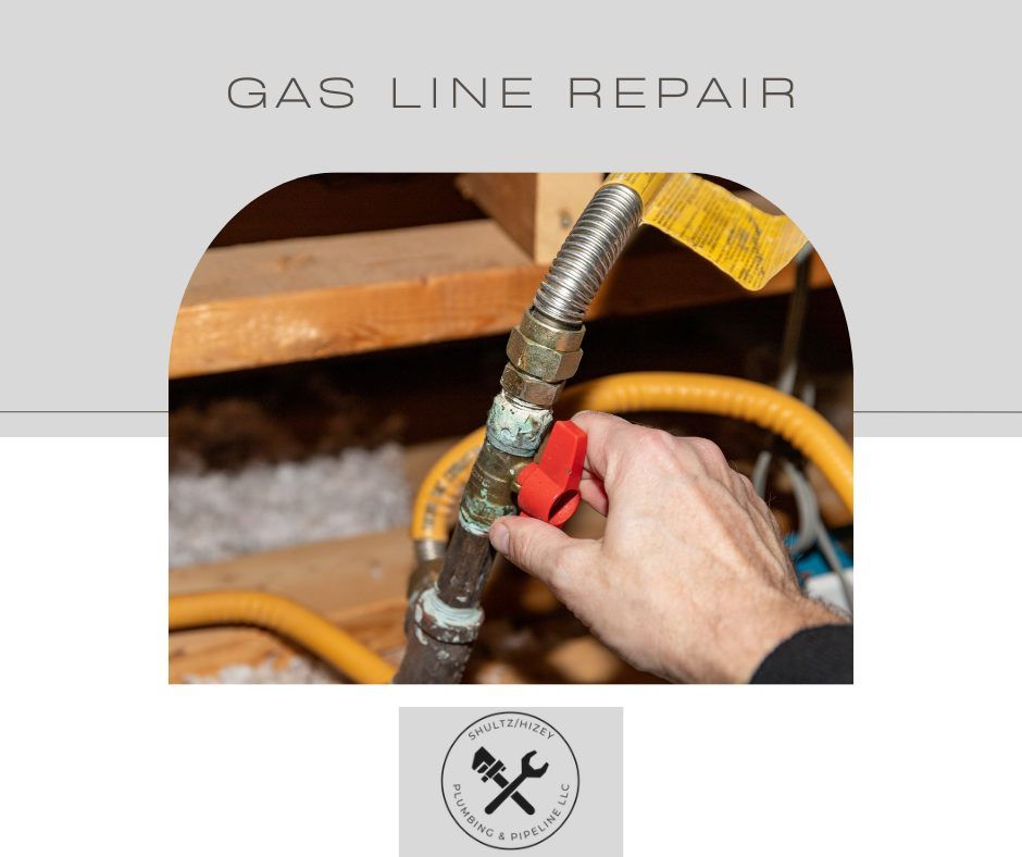 Gas line repair: Hand turning a red gas shut-off valve on a corroded pipe in a wooden setting.