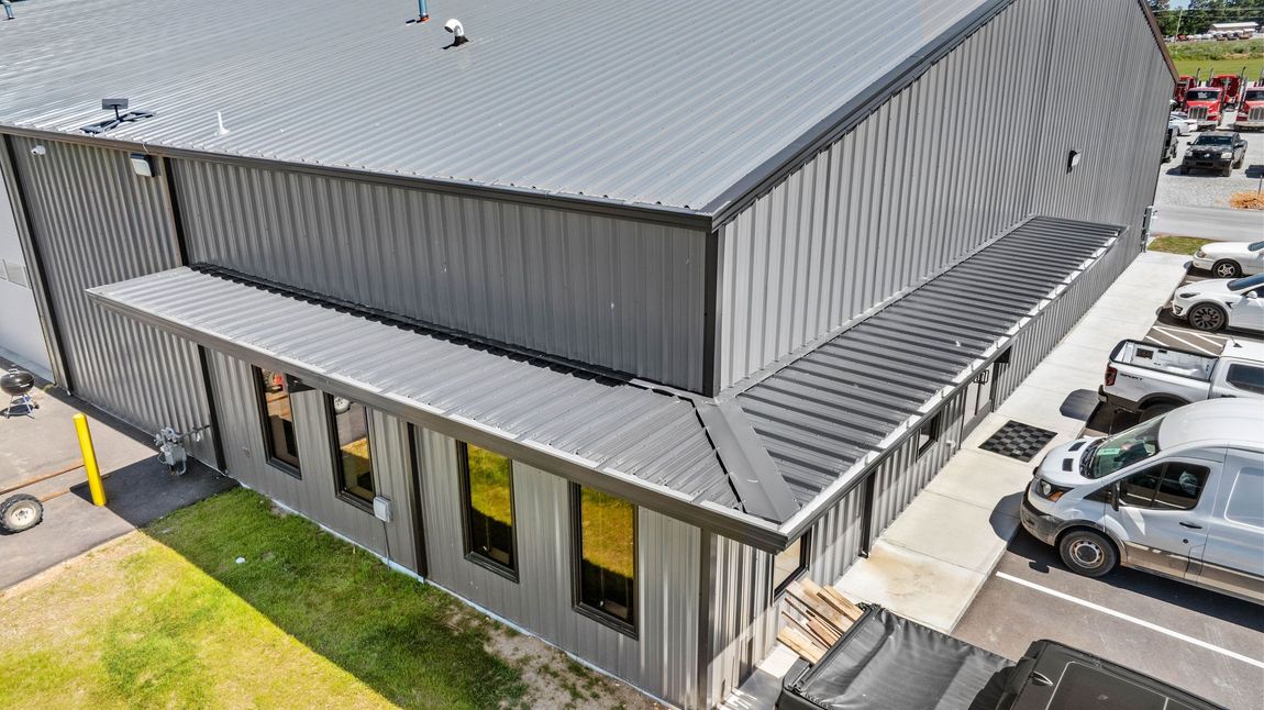 Top view of the entrance of a Commercial Metal Shop Building Manufactured by Quality Metal Building Systems in Gentry, Ar