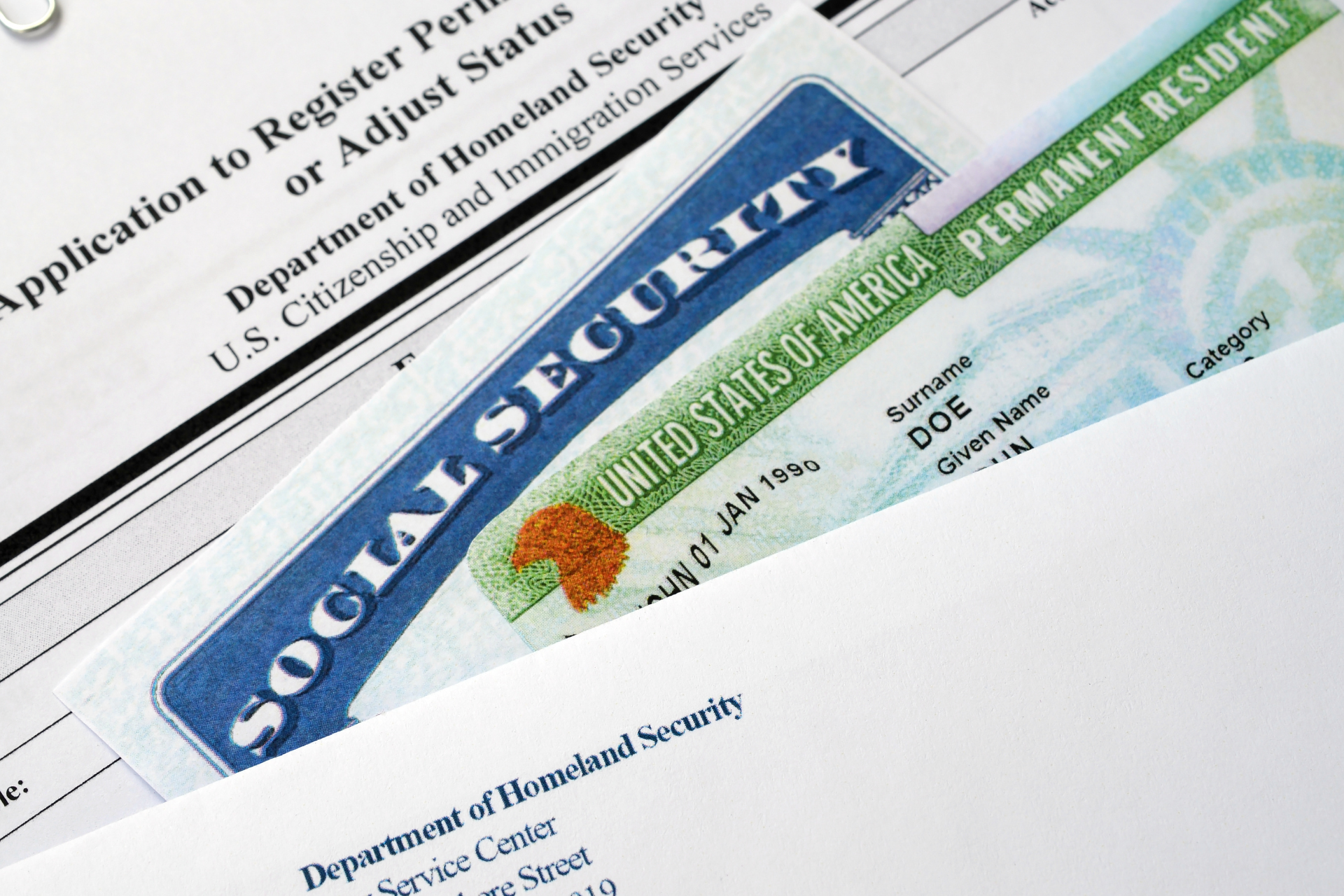 Social Security card on top of immigration and employment forms