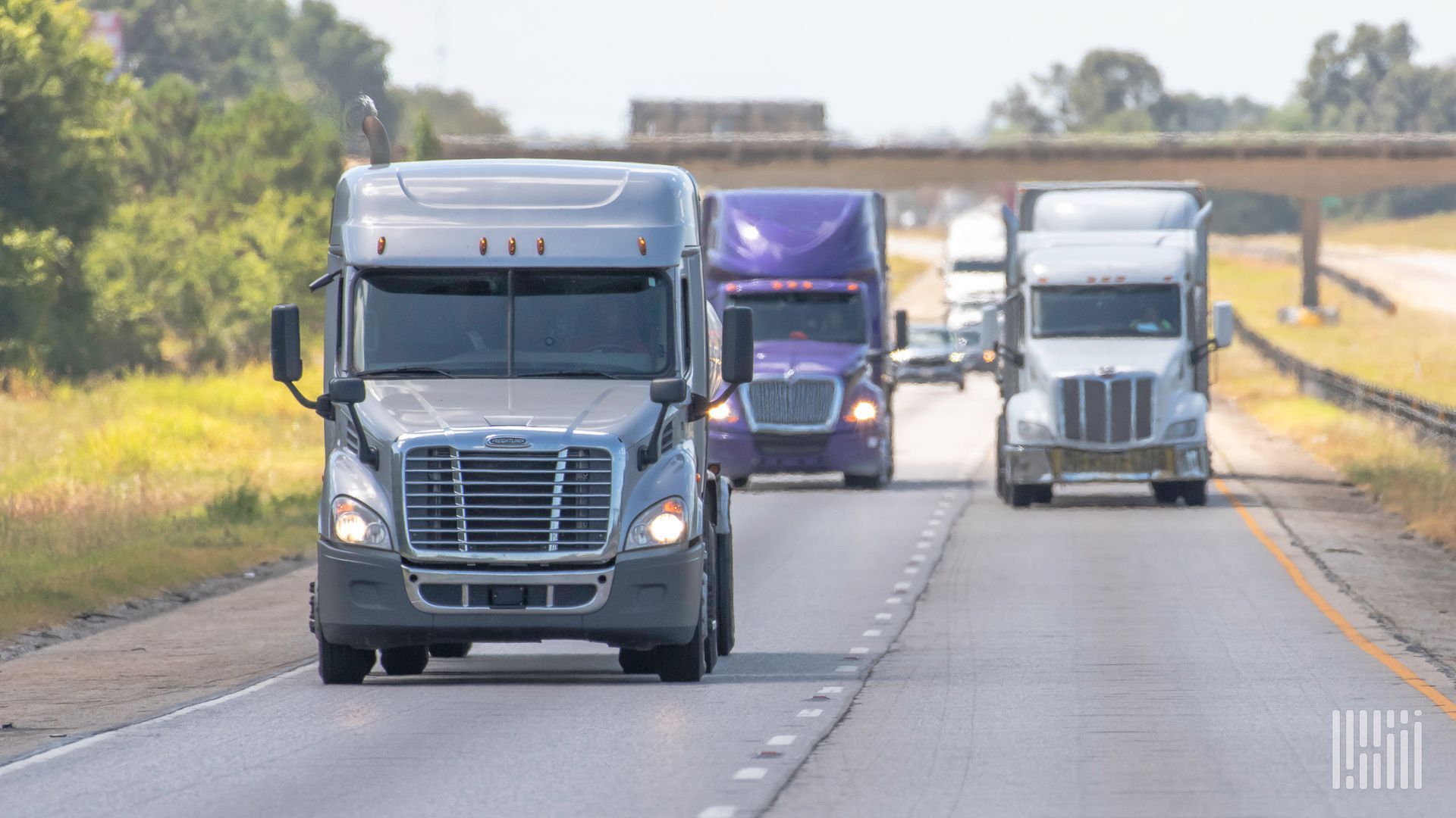 long haul trucking trucks have insurance on road