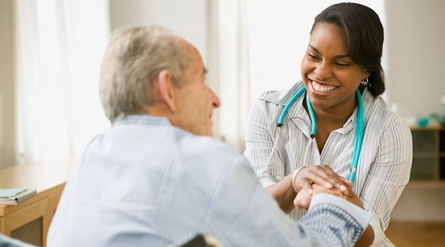 smiling individuals discuss medicare advantage