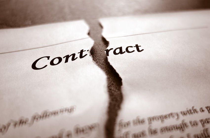 A piece of paper with the word contract written on it