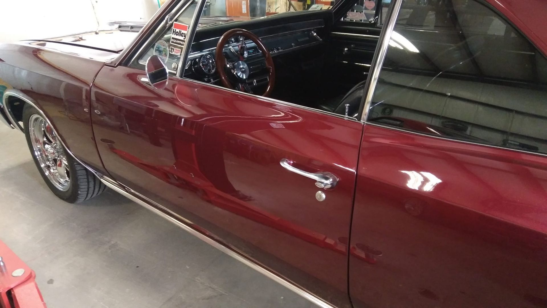 a red car serviced by Big Daddy Customs