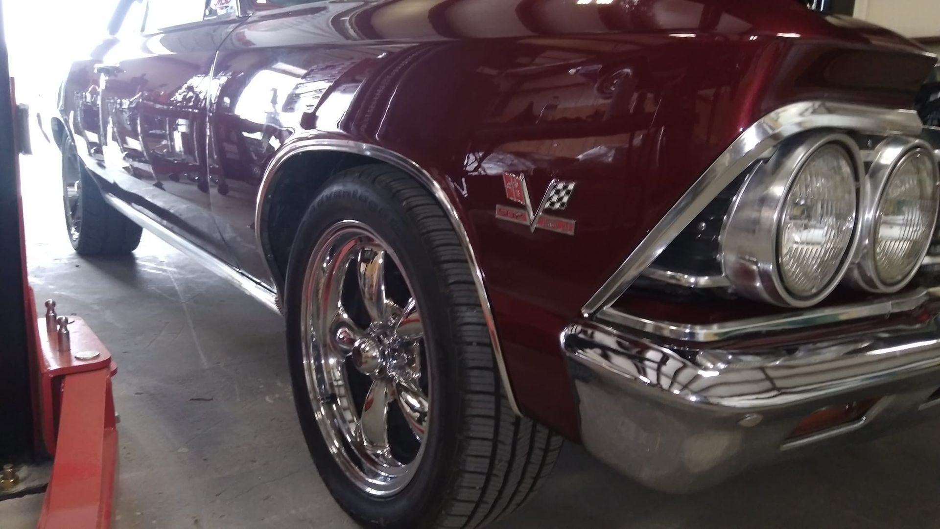 front of red car serviced by Big Daddy Customs
