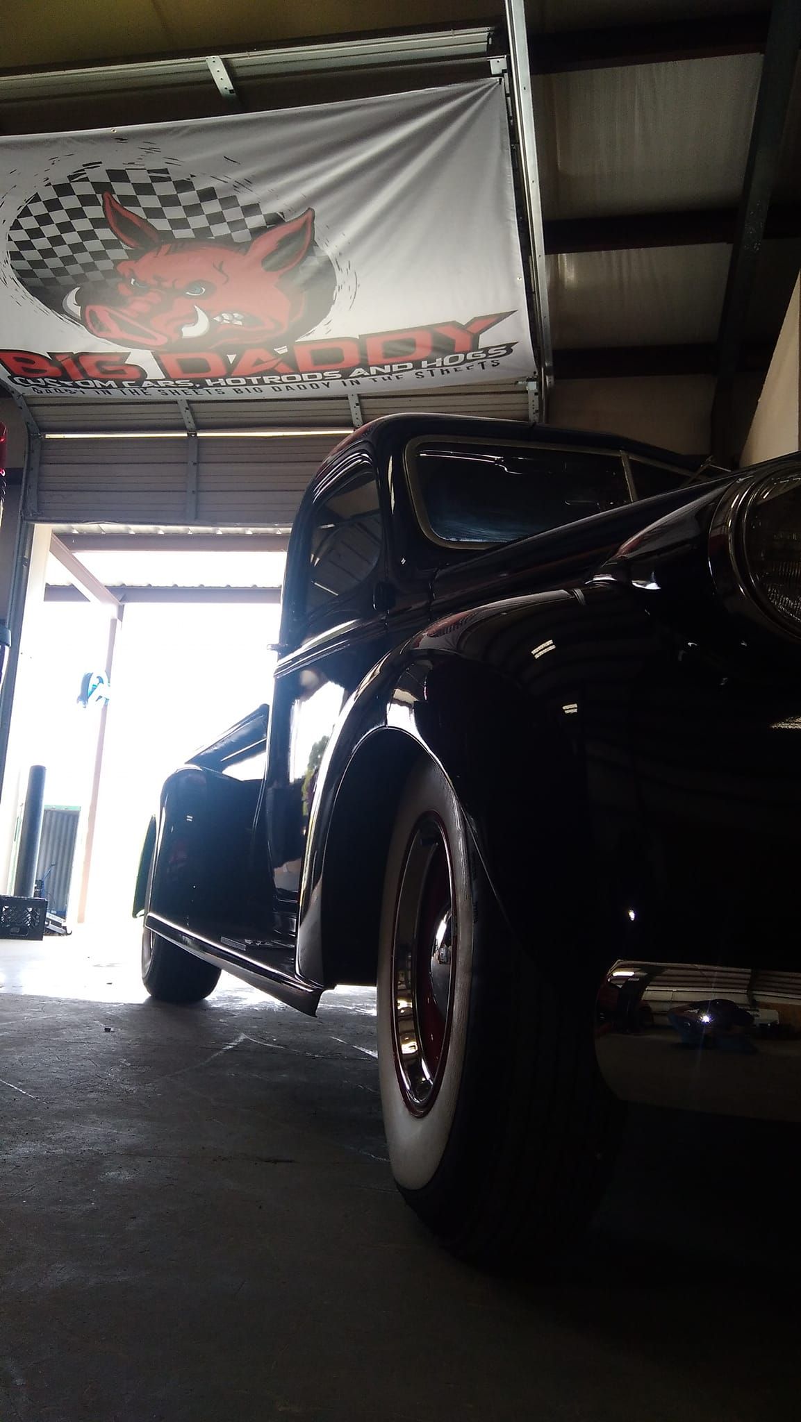 side front profile of a black vintage car 