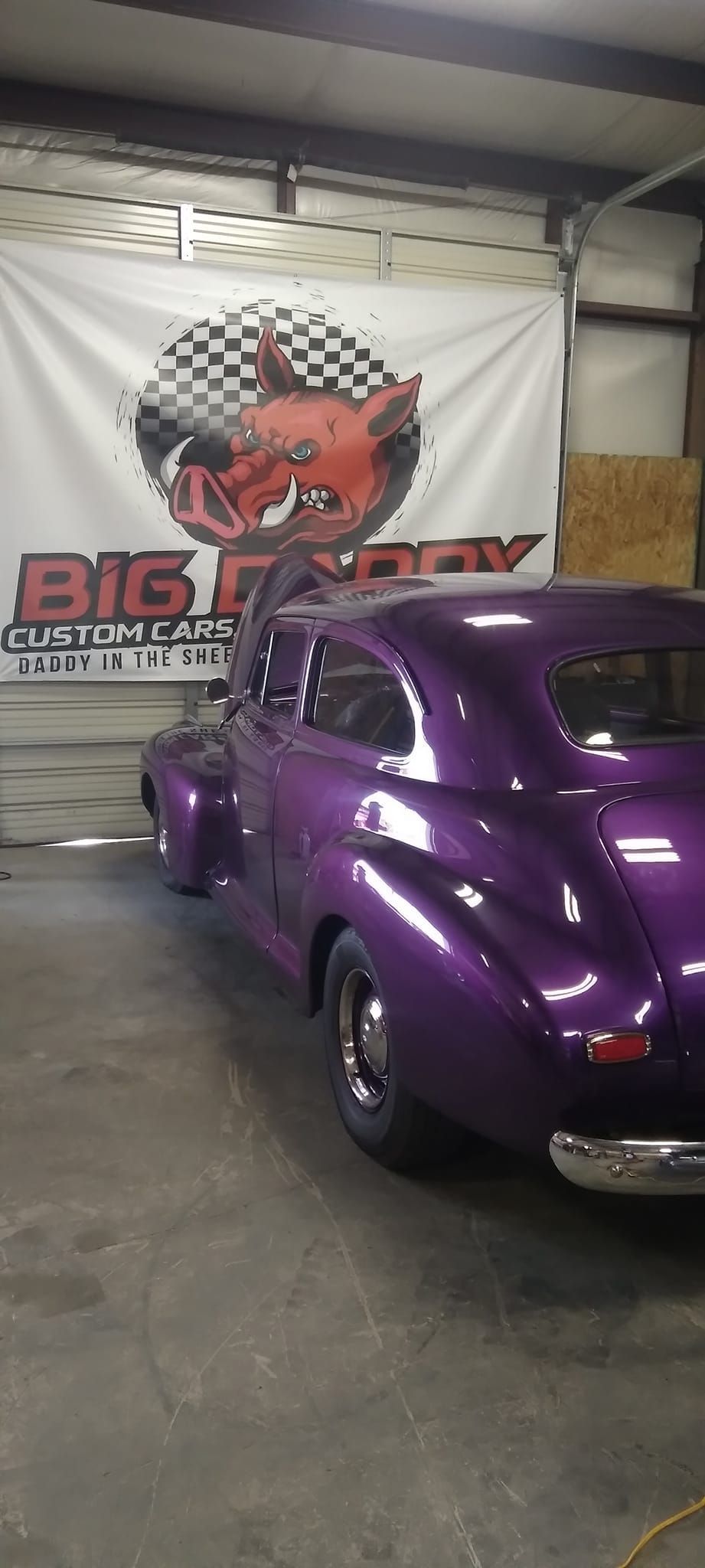 the back of a purple vintage car