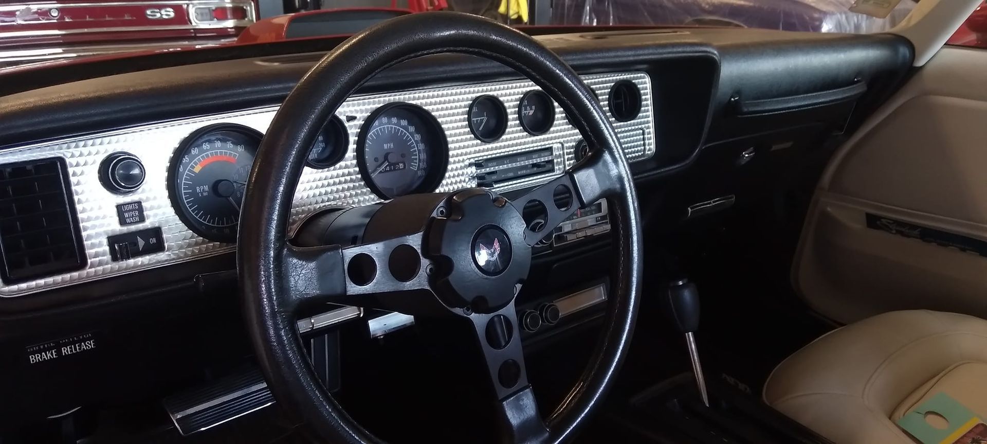 close up of a wheel in a vintage car