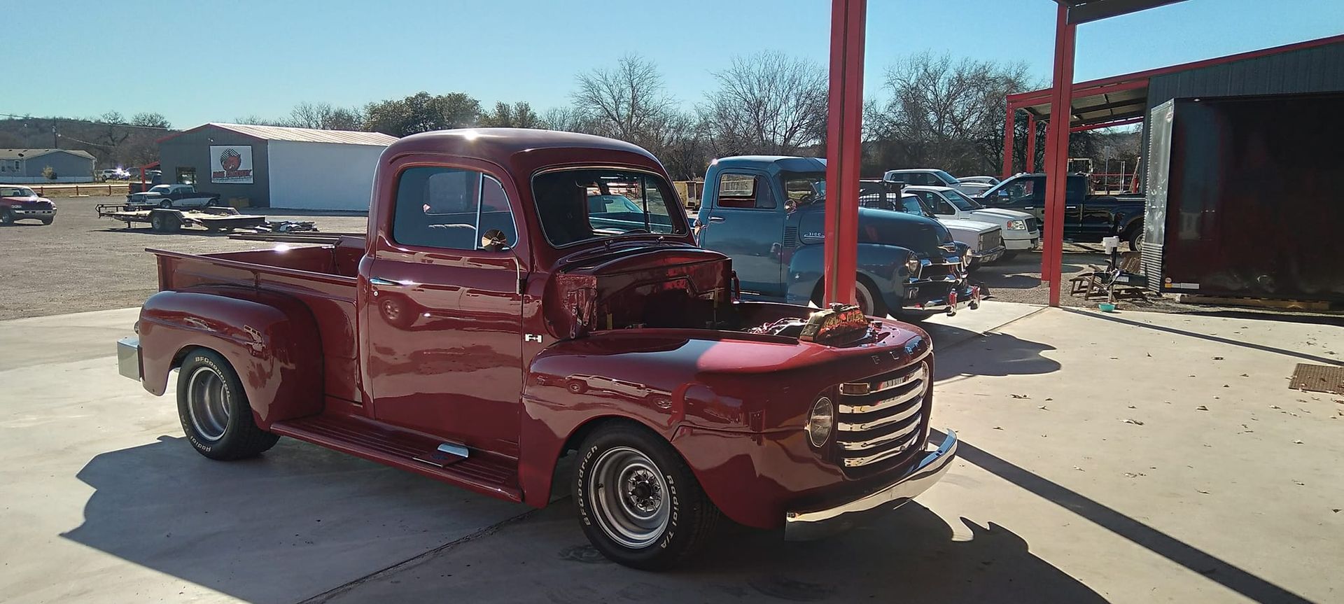 vintage red truck with hood open